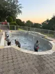 Pool remodeling in Austin: site protection and installation of plaster, tile, and coping
