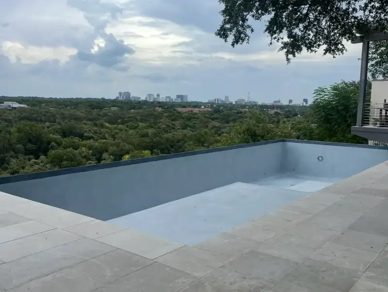 Pool replastering in Austin — smooth quartz and pebble finishes
