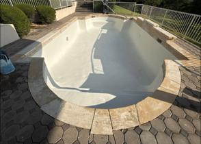 Pool remodeling in Austin: surface preparation, coping and tile installation, deck resurfacing