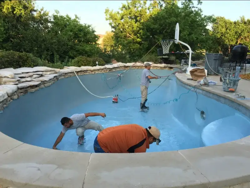 Commercial pool plastering project in Austin with a newly finished swimming pool surface
